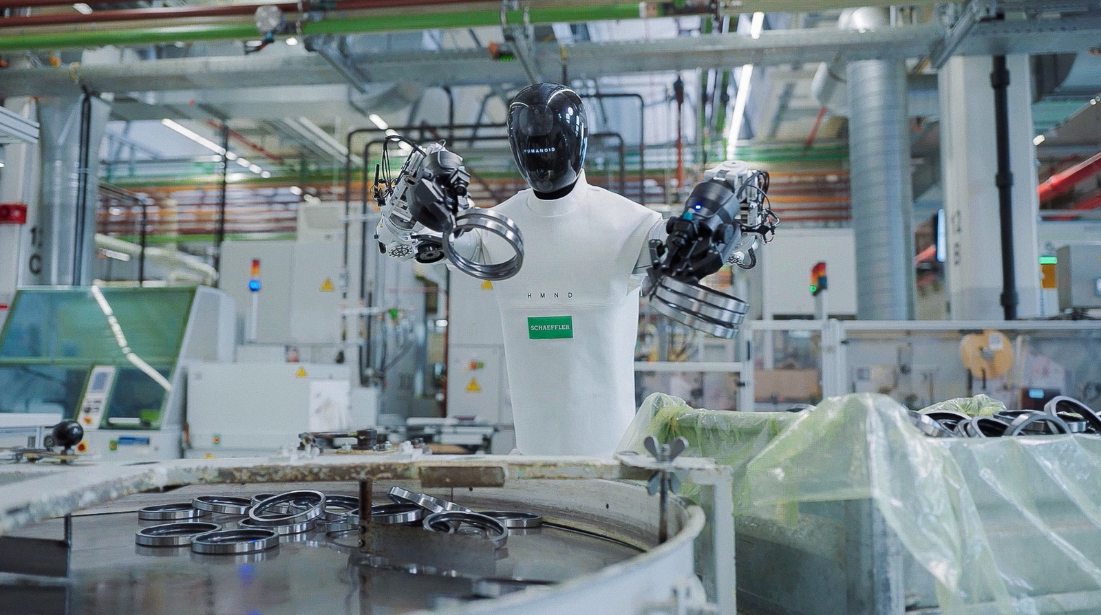 A HMND 01 robot in an industrial setting in an archival Humanoid photograph