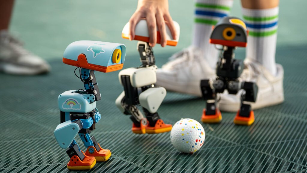 Three real Microduck robots in Pollen Robotics' official launch photography