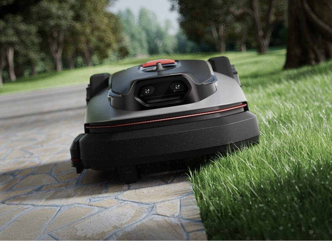 Roborock RockNeo Q1 official image mowing along a lawn edge