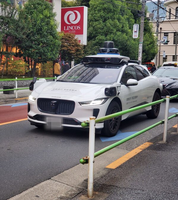 Waymo Jaguar I-PACE testing in Tokyo — real vehicle photo with Japanese markings