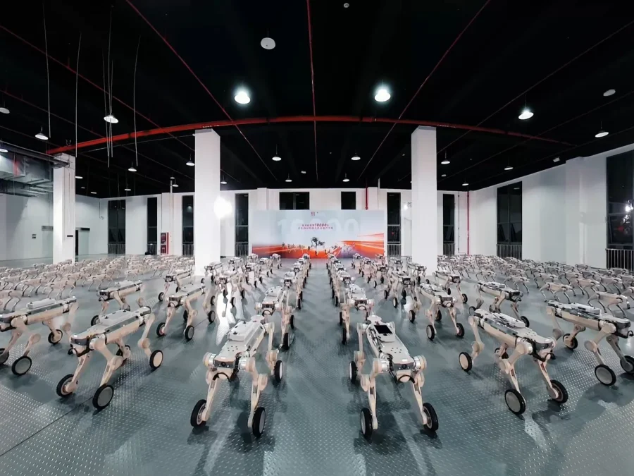 Rows of GENISOM AI quadruped robots inside a hall in an archival manufacturer photograph