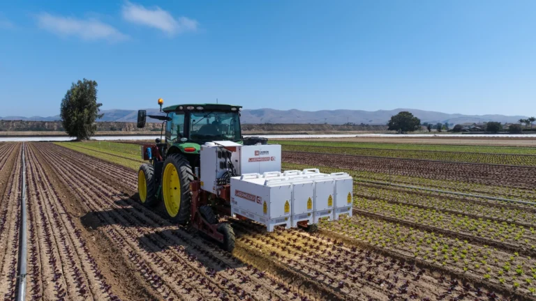 Carbon Robotics LaserWeeder G2 200 operating with a tractor