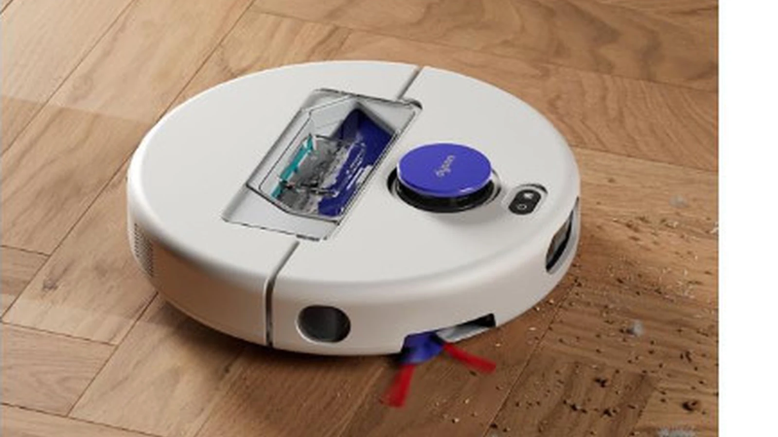 Dyson R1 Nurovi robot vacuum cleaning debris on a wooden floor