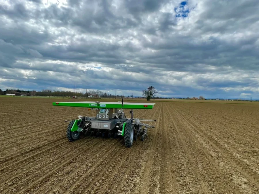 FarmDroid FD20 with solar panels in a field