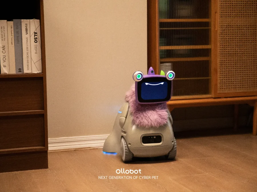 Purple OlloNi SS1 companion robot indoors, official OlloBot material