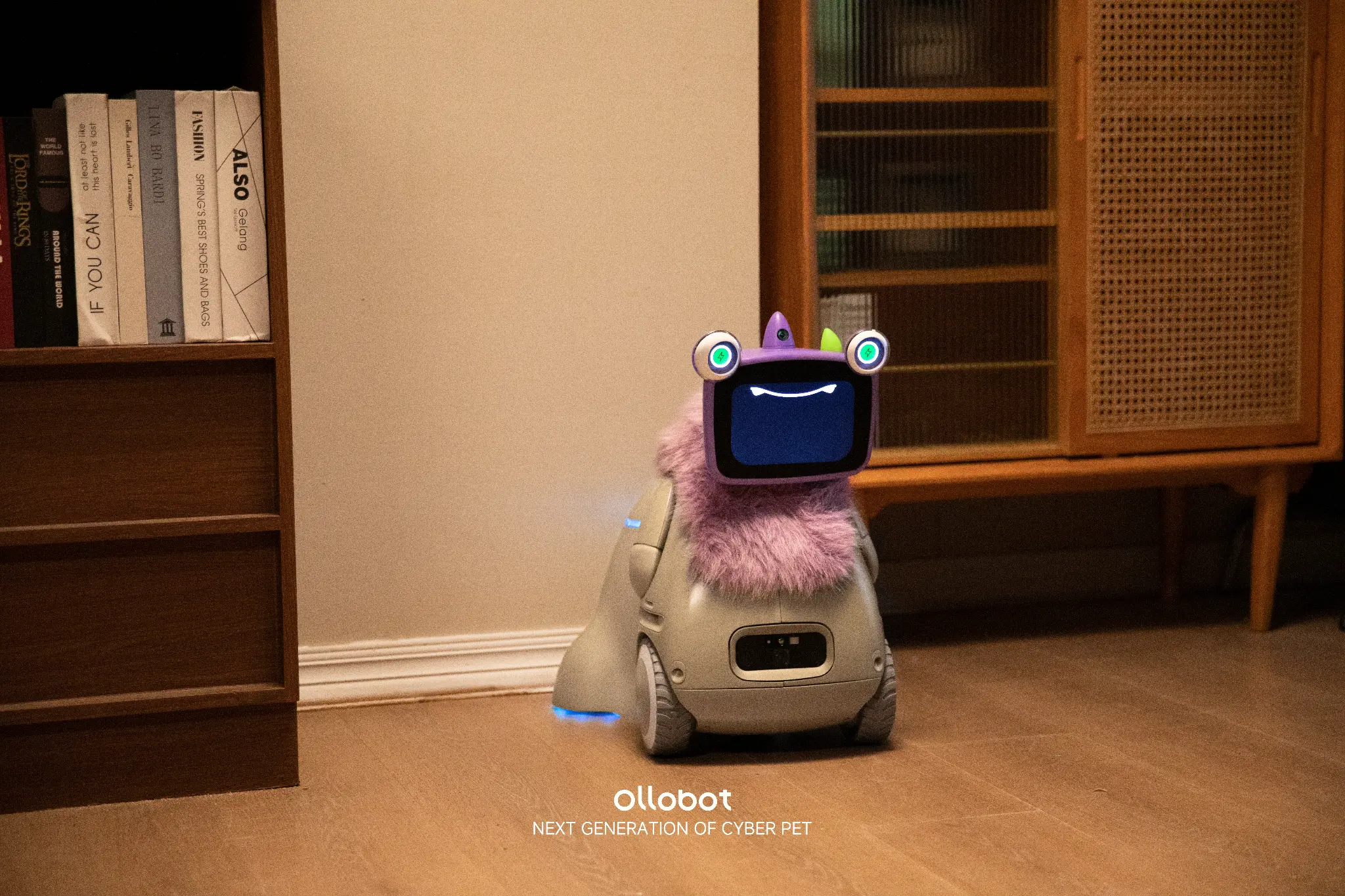 Purple OlloNi SS1 companion robot indoors, official OlloBot material