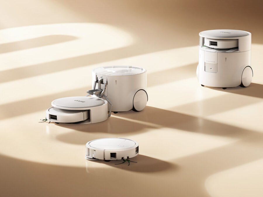 Roomba Duo main unit with a deployment arm and compact companion robot, official iRobot visualization