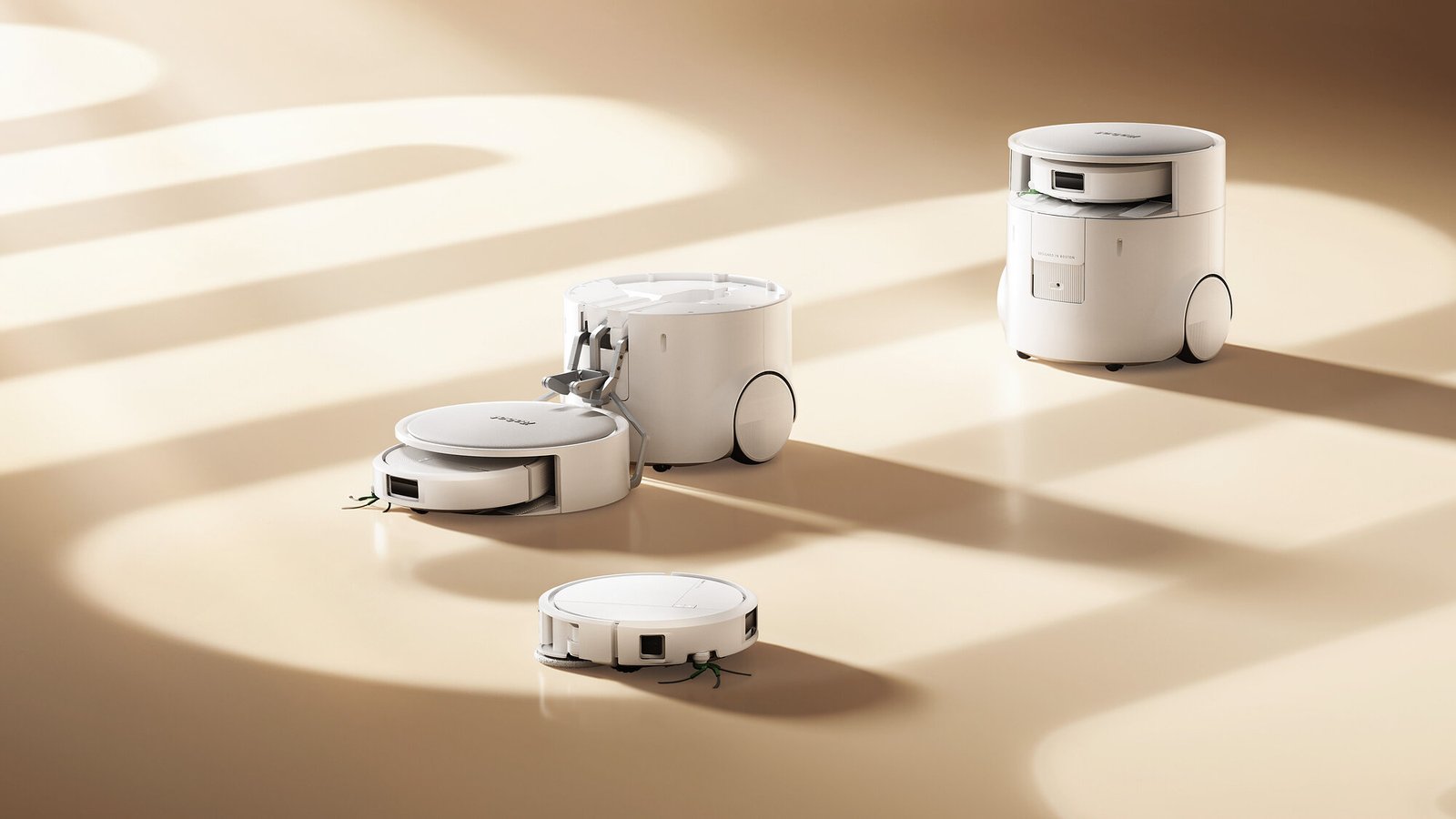 Roomba Duo main unit with a deployment arm and compact companion robot, official iRobot visualization
