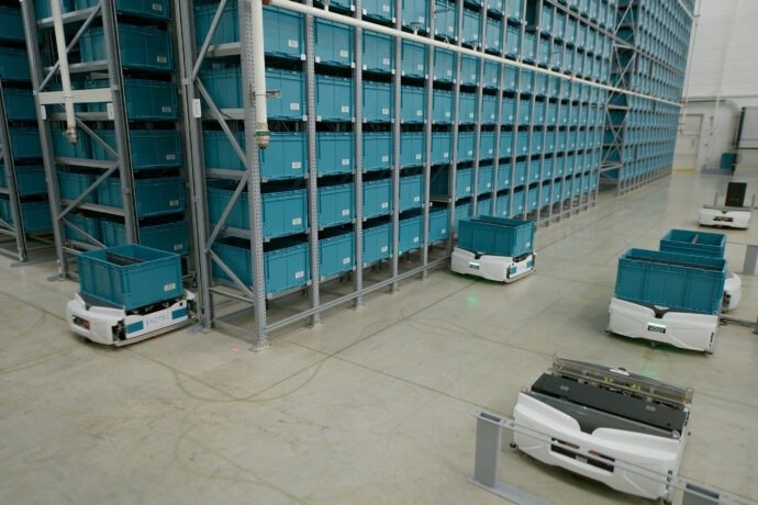 Exotec Skypod robots between racks at Carrefour Reims. Photograph: Exotec.