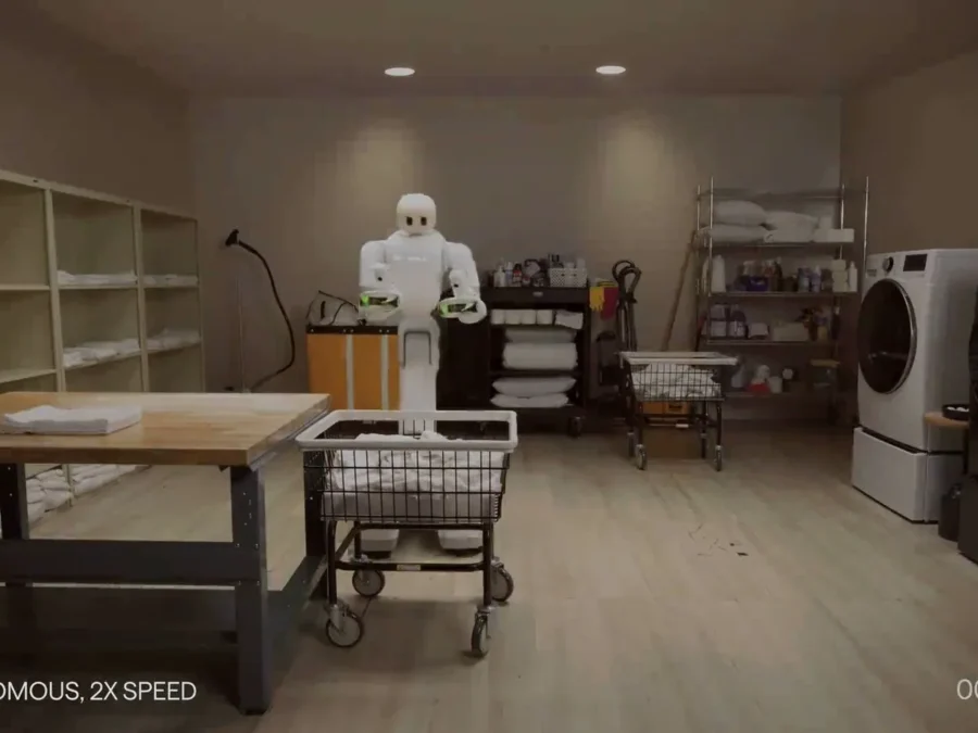 Robot Taku pracujący w pralni podczas autonomicznego workflow Dyna 2.1 — oficjalny materiał Dyna Robotics