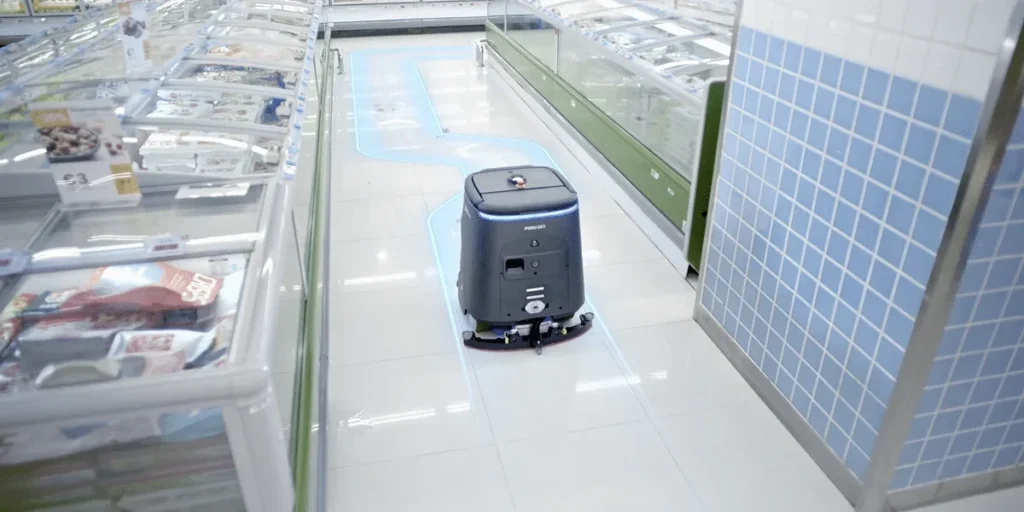 PUDU CC1 Pro autonomous cleaning robot at a commercial facility