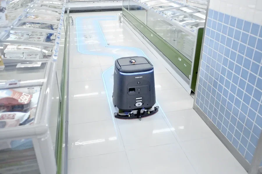 PUDU CC1 Pro autonomous cleaning robot at a commercial facility