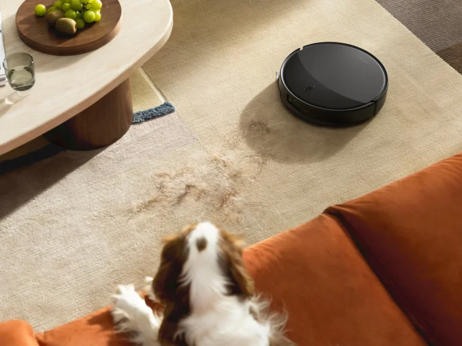 Roborock Saros 20 robot vacuum in a home near a pet