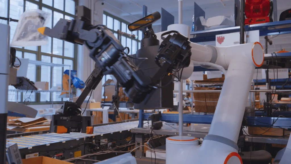 Ultra OP1 dual-arm robot at a warehouse packing station