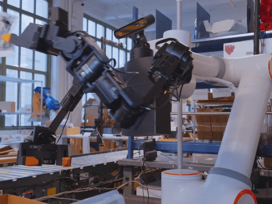 Ultra OP1 dual-arm robot at a warehouse packing station