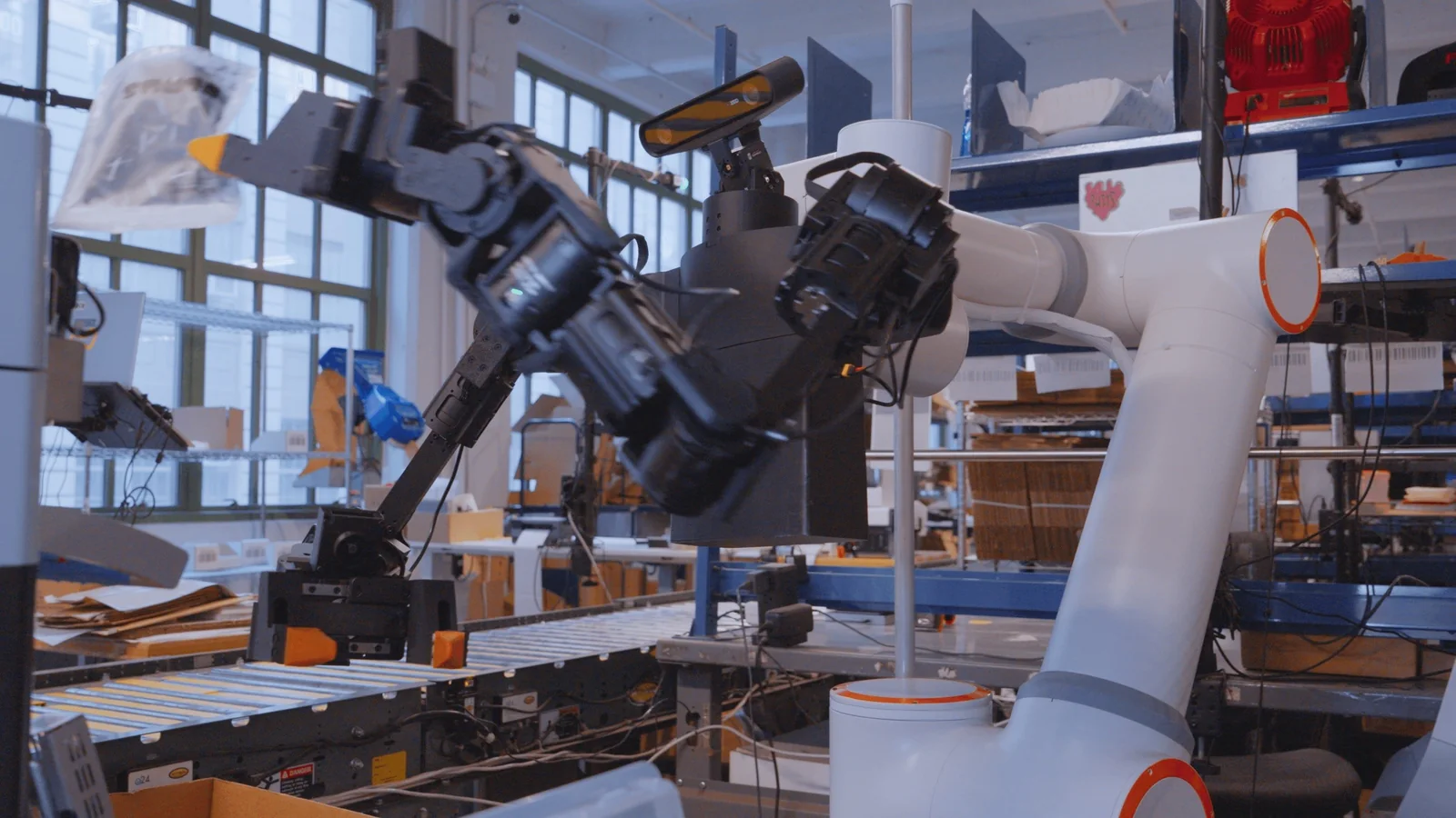 Ultra OP1 dual-arm robot at a warehouse packing station