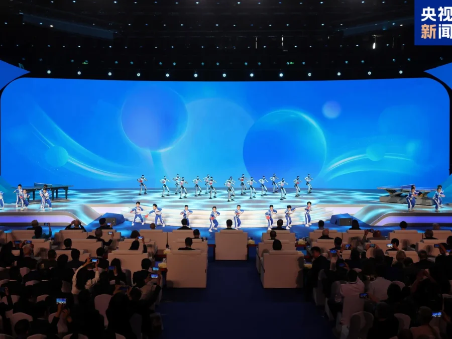 A group of Unitree humanoids on stage at a ping-pong diplomacy event; CCTV News image supplied by Unitree.